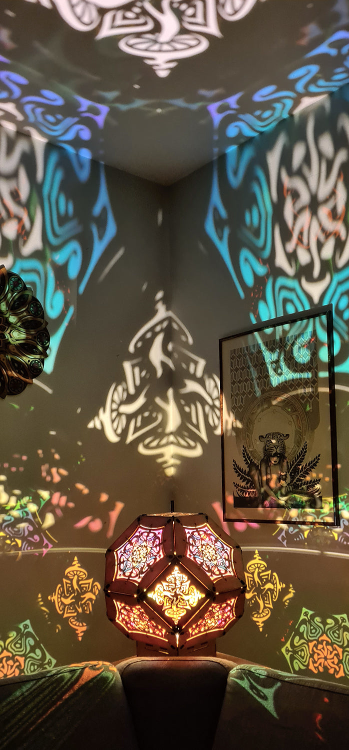 Illuminated kaleidoscope-style shadow lamp with a geometric mushroom design projecting colorful patterns on walls and ceiling.