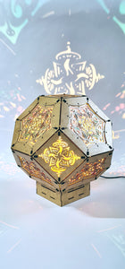 Illuminated kaleidoscope-style shadow lamp with a geometric mushroom design projecting colorful patterns on walls and ceiling.