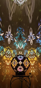 Psychedelic wooden geometric shadow lamp that projects colorful trippy shadows onto the walls