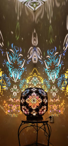 Psychedelic wooden geometric shadow lamp that projects colorful trippy shadows onto the walls