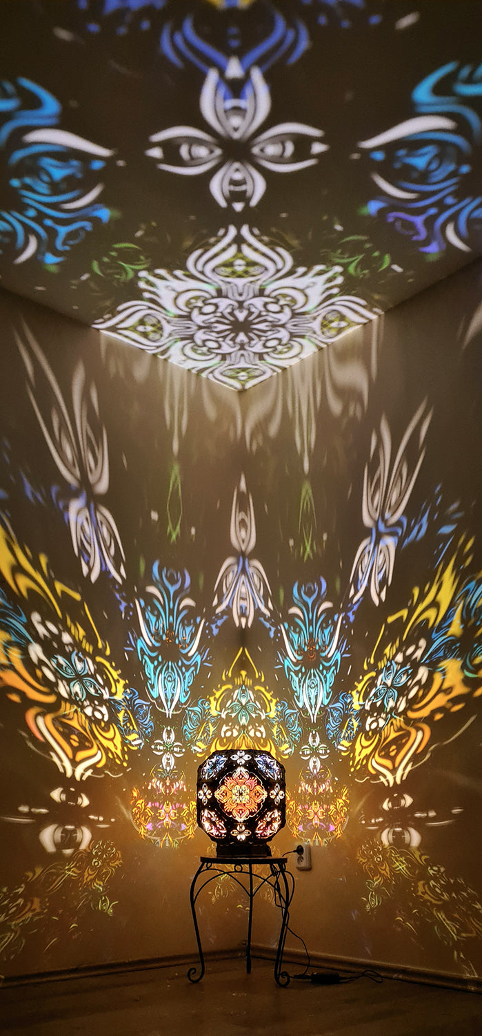 Psychedelic wooden geometric shadow lamp that projects colorful trippy shadows onto the walls