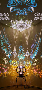 Psychedelic wooden geometric shadow lamp that projects colorful trippy shadows onto the walls