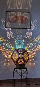 Psychedelic wooden geometric shadow lamp that projects colorful trippy shadows onto the walls