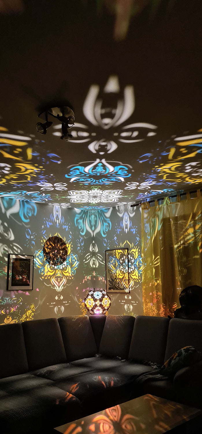 Psychedelic wooden geometric shadow lamp that projects colorful trippy shadows onto the walls