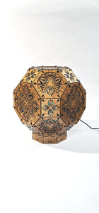 Psychedelic wooden geometric shadow lamp that projects colorful trippy shadows onto the walls