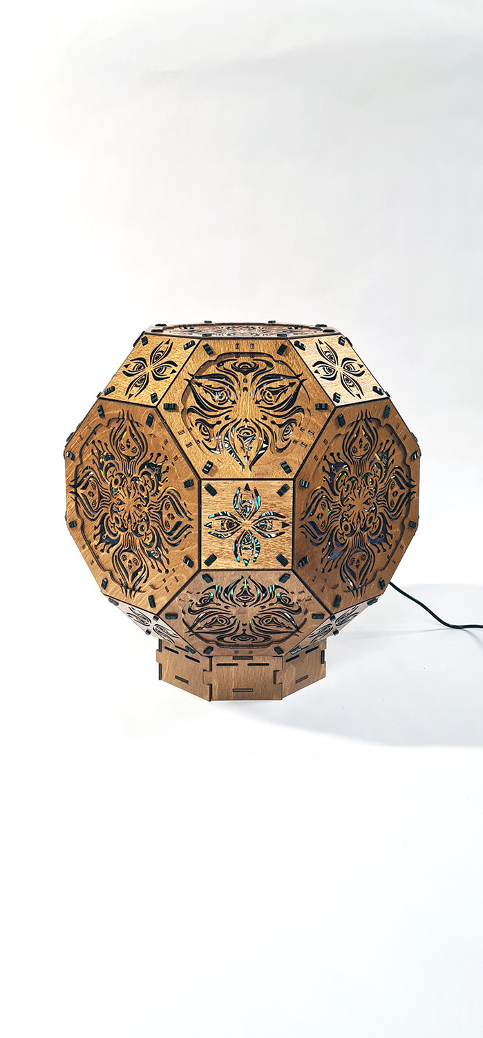 Psychedelic wooden geometric shadow lamp that projects colorful trippy shadows onto the walls