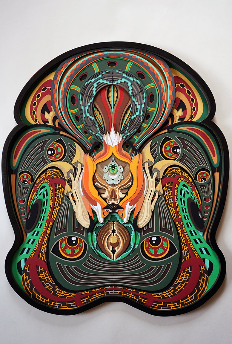 Layered paper art of forest spirit with foxes, mushrooms, and acorn, symbolizing growth, nature’s energy, and oneness.