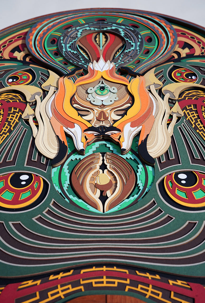 Layered paper art of forest spirit with foxes, mushrooms, and acorn, symbolizing growth, nature’s energy, and oneness.