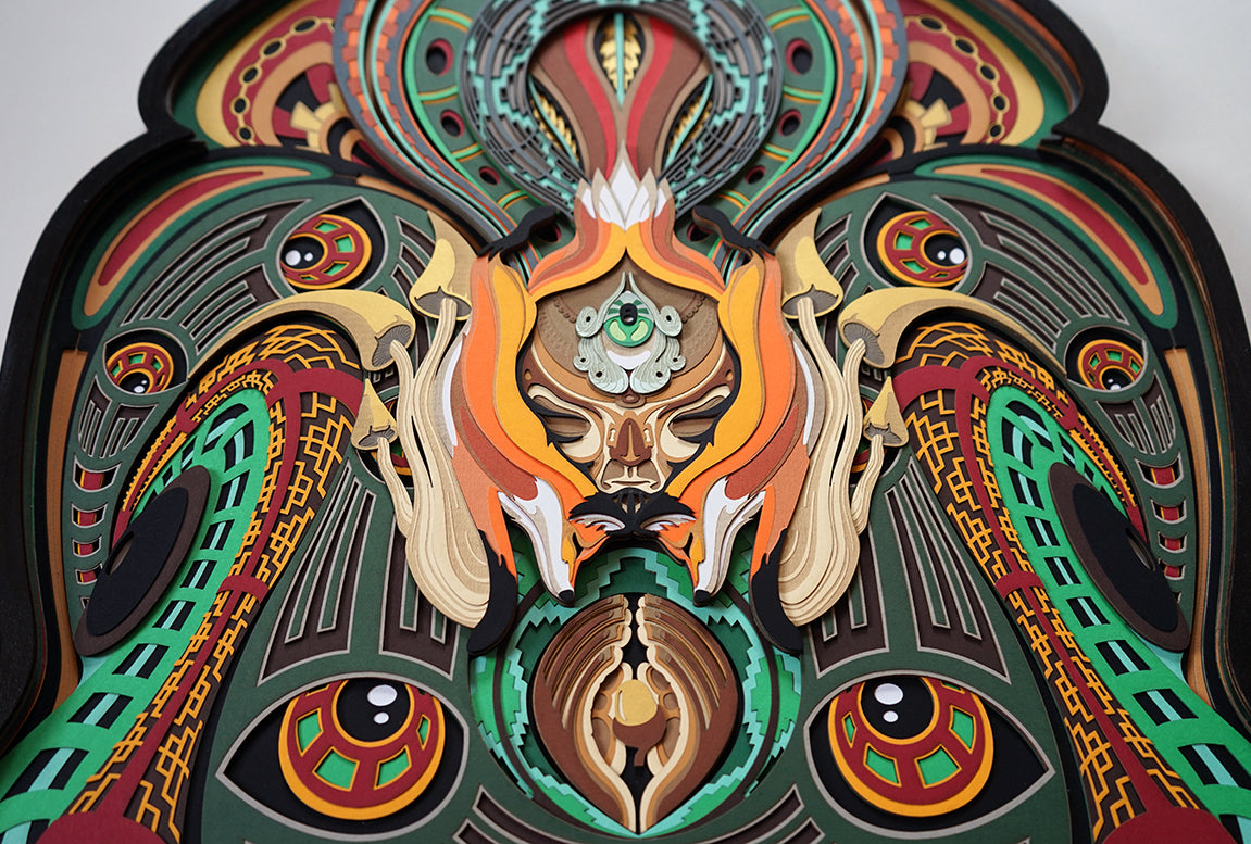 Layered paper art of forest spirit with foxes, mushrooms, and acorn, symbolizing growth, nature’s energy, and oneness.