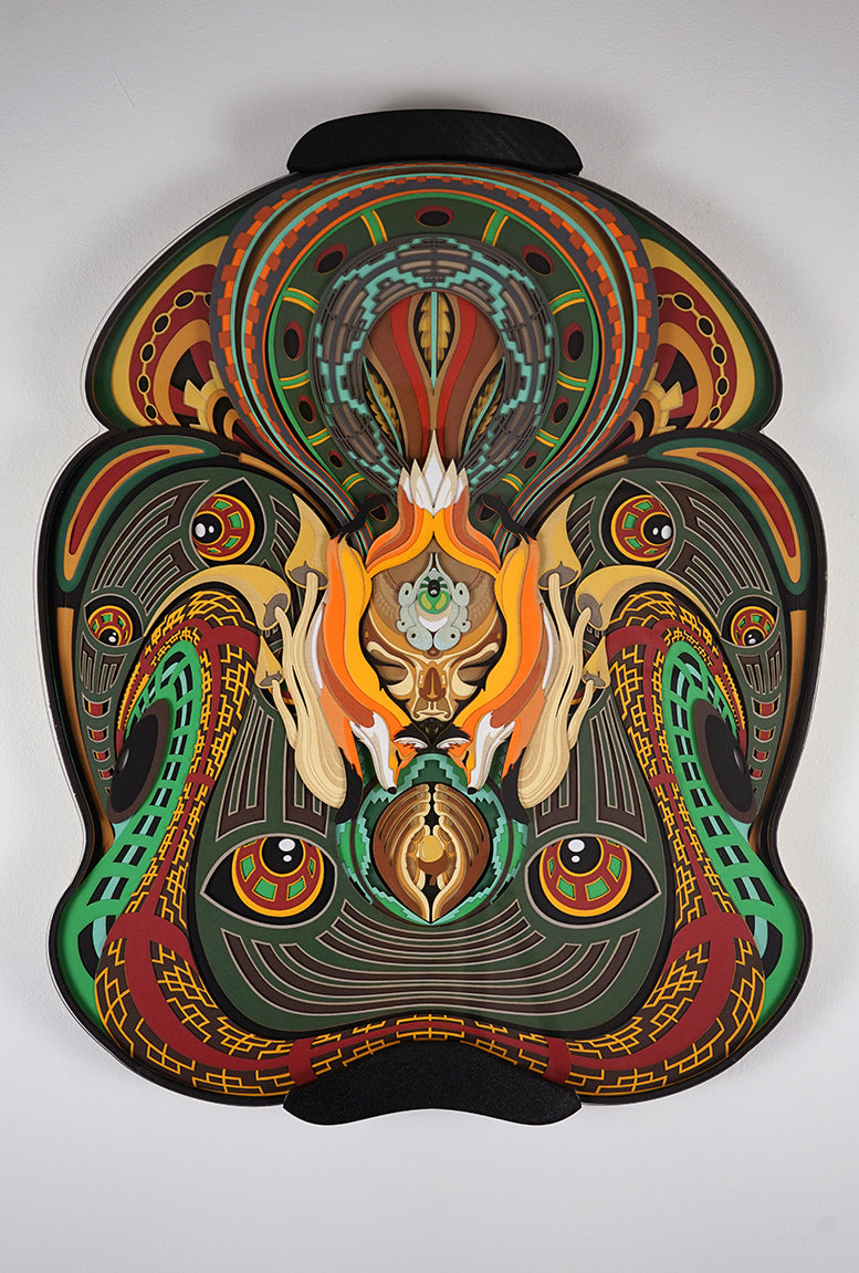 Layered paper art of forest spirit with foxes, mushrooms, and acorn, symbolizing growth, nature’s energy, and oneness.