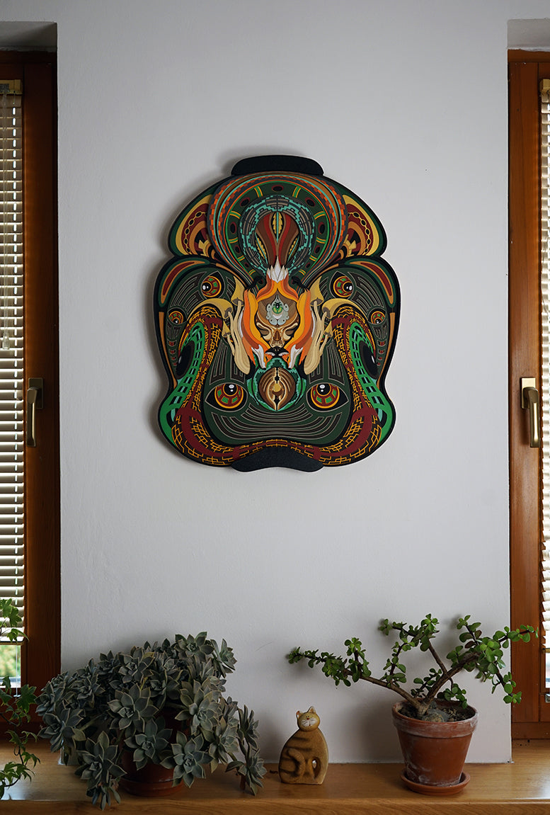 Layered paper art of forest spirit with foxes, mushrooms, and acorn, symbolizing growth, nature’s energy, and oneness.