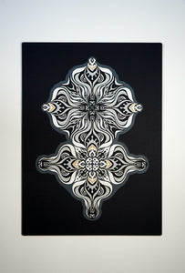 Layered grayscale paper artwork from the Metamorphs series where mandala geometry shifts into creature like spirits.