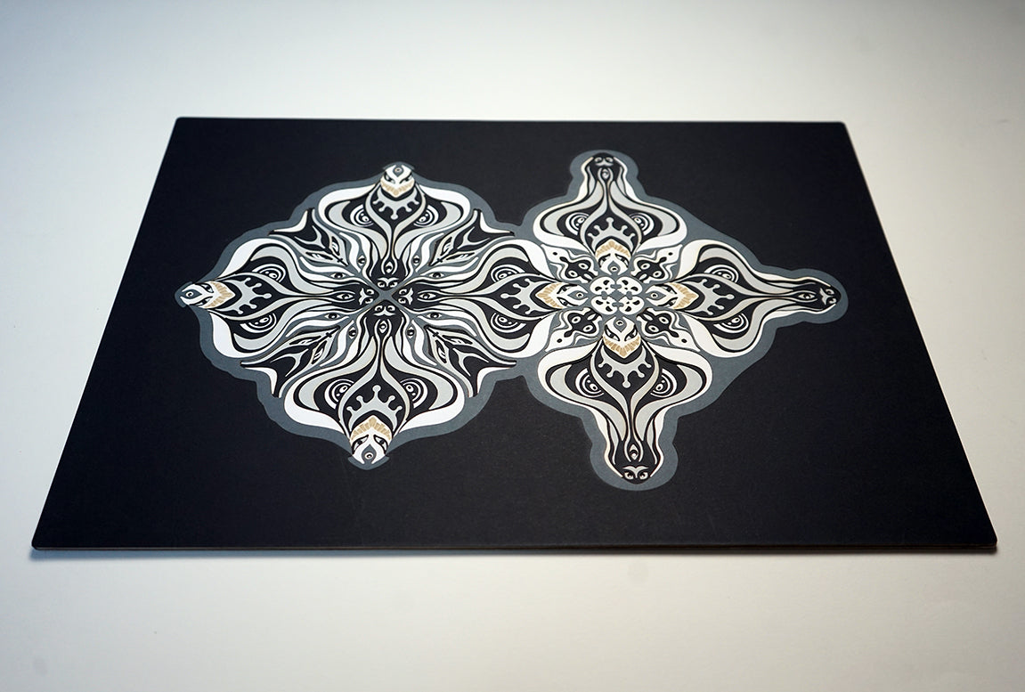 Layered grayscale paper artwork from the Metamorphs series where mandala geometry shifts into creature like spirits.