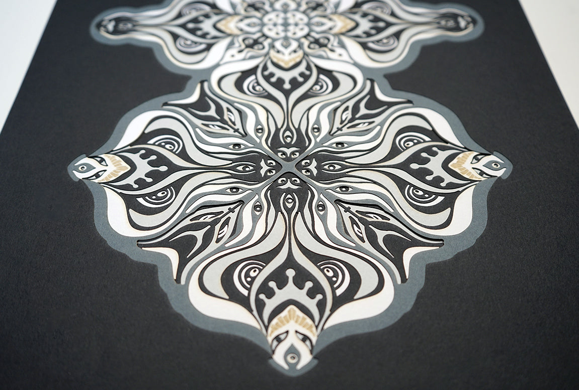 Layered grayscale paper artwork from the Metamorphs series where mandala geometry shifts into creature like spirits.