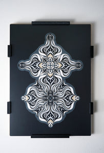 Layered grayscale paper artwork from the Metamorphs series where mandala geometry shifts into creature like spirits.