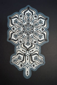 Complex black and white paper layers forming interconnected mandalas that hide subtle morphing faces.