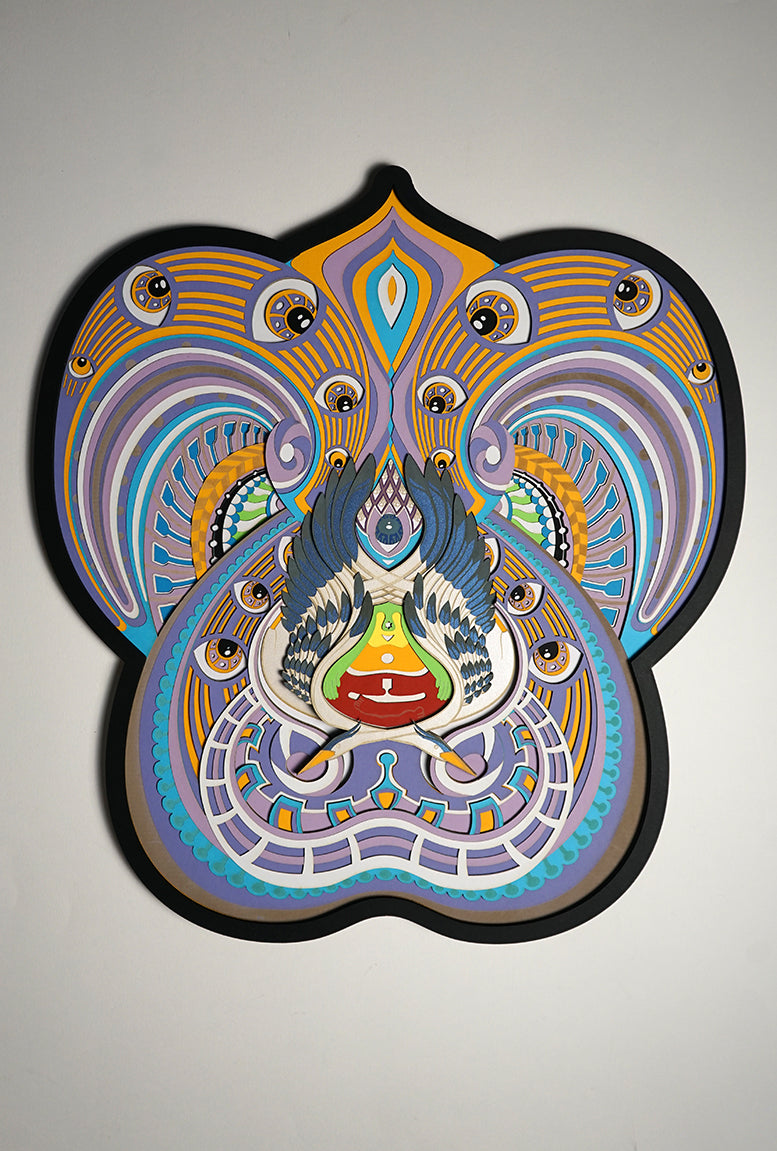 Visionary papercut artwork of a meditating figure with chakras and herons, representing oneness, enlightenment, and cosmic flow.