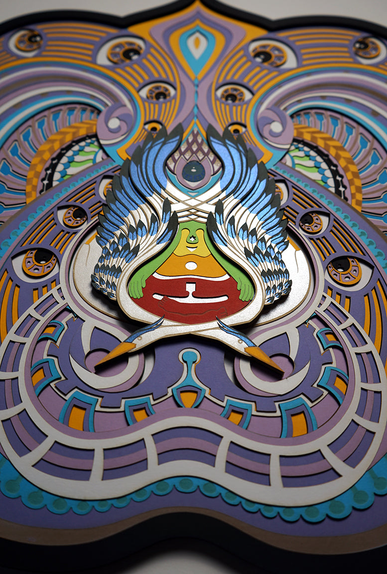 Visionary papercut artwork of a meditating figure with chakras and herons, symbolizing unity, awareness, and transcendence.