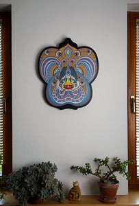 Visionary papercut artwork of a meditating figure with chakras and herons, representing oneness, enlightenment, and cosmic flow. 