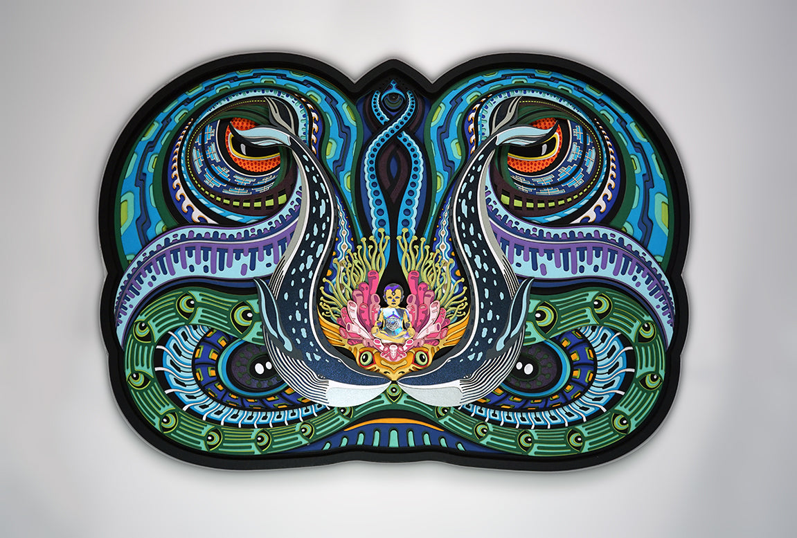 Layered paper art of infant on coral throne with whales and ocean patterns, symbolizing life’s origin and unity.