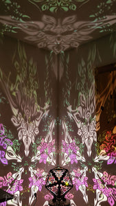 Psychedelic geometric wooden shadow lamp that projects crispy flower reminiscent mandalas onto the walls