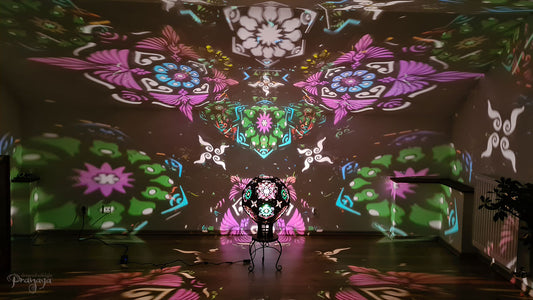 A psychedelic geometric shadow lamp projecting colorful cactus mandalas on the walls