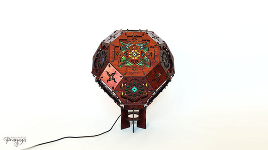 A psychedelic geometric shadow lamp projecting colorful cactus mandalas on the walls