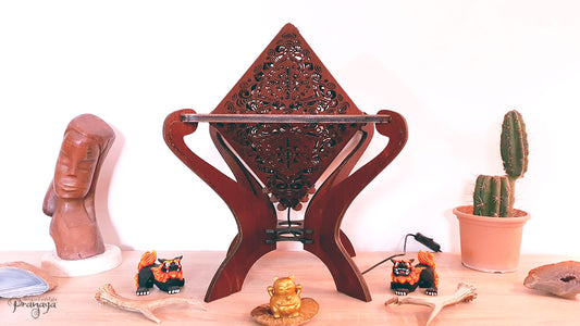 Octahedron wooden shadow lamp projecting a geometric pattern on a wall.