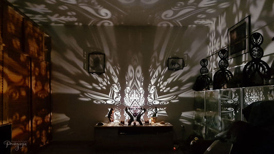 Octahedron wooden shadow lamp projecting a geometric pattern on a wall.